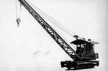 A locomotive crane on railroad car.