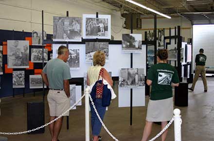 Exhibit visitors with University Library staffer Terri Greer.