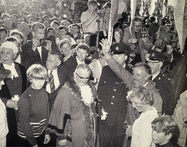 Photo of Manry greeting crowd