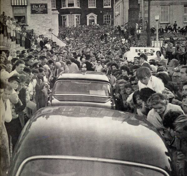 Photo of Manry riding through crowd