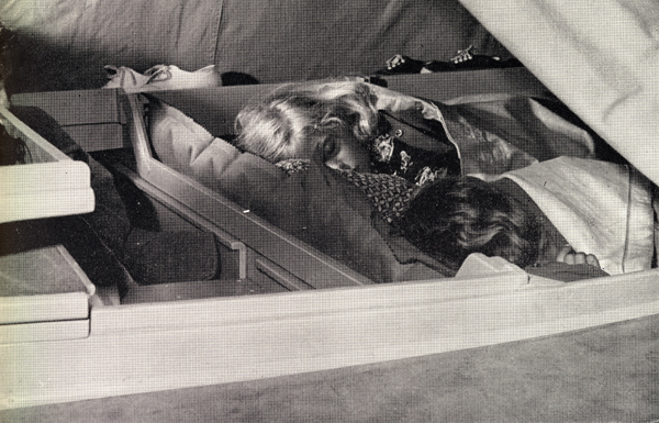 Photo of Robin and Douglas Manry asleep aboard Tinkerbelle