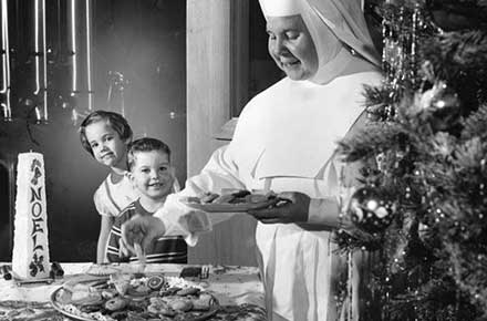 Sister working on Christmas cookies, 1959