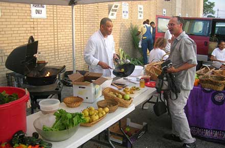 Cooking demonstration at the first Fresh Stop at W. 25th and Lorain, 2006