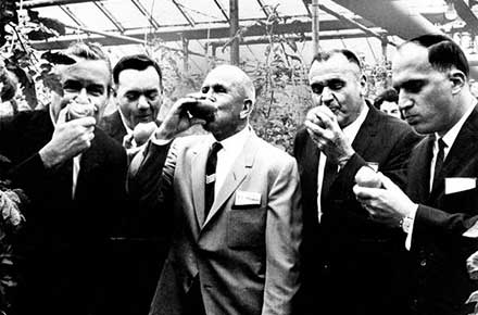 Ohio Gov. James A. Rhodes enjoys a tomato tasting at a local Cleveland area greenhouse, 1966.