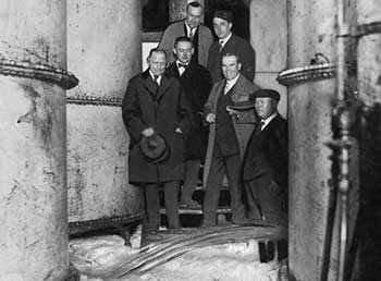 Prohibition agents watch beer storage tanks emptied at Leisy Brewery, 1923