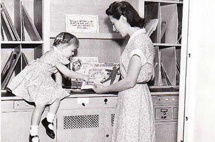 Woman and child in music room, 1955?