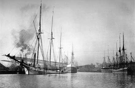 Scene on the River - Boats Unloading Ore