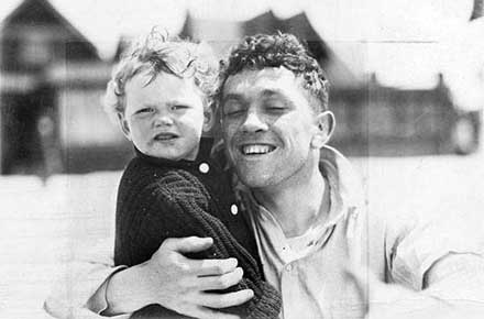 Champion boxer Johnny Kilbane with his daughter, Mary, 1913.