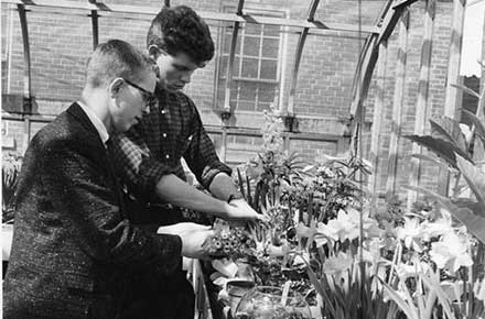 Peter Wotowiec with a student at West Technical High School greenhouse